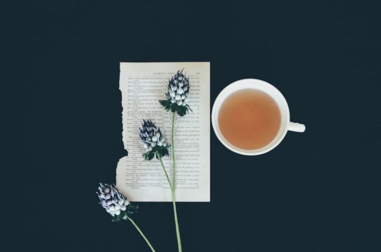 Matcha Tea Whisk - white ceramic tea cup beside white flowers