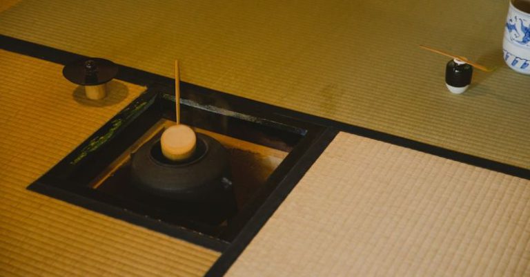 Chashaku Tea Scoop - High angle of traditional Japanese tea ceremony in Urasenke style in spacious light room on floor with fire pit with kettle and water ladles near pot