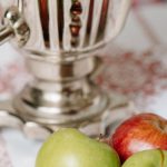 Russian Samovar Tea - Green Apple Fruit Beside Stainless Steel Pitcher