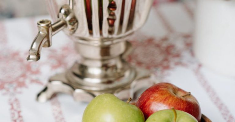 Russian Samovar Tea - Green Apple Fruit Beside Stainless Steel Pitcher