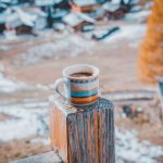 Wooden Tea Box - white, orange, and blue ceramic mug with brown liquid inside