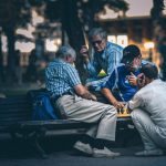 Lapsang Souchong Bag - man in blue and white plaid dress shirt sitting on bench