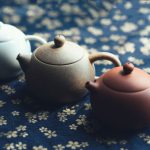 Teapot Pouring Tea - three assorted-color teapots