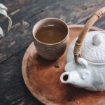 Long Jing Tea Tray - white and brown ceramic teapot on wooden tray