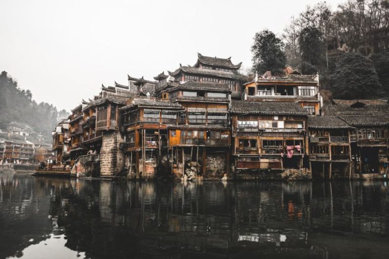 China Tea Map - brown wooden houses beside river