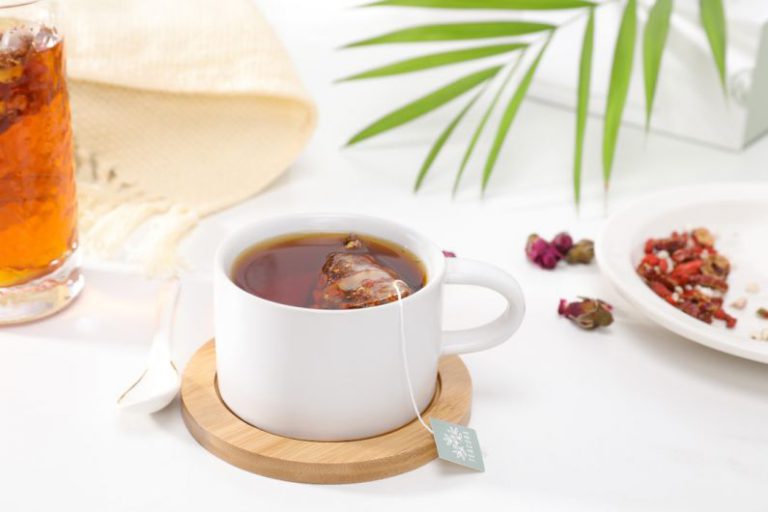 Rooibos Tea Red - white ceramic mug with brown liquid inside