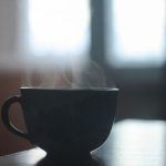 Flavored Tea Meng - black ceramic teacup on table