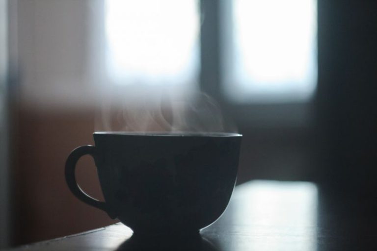Flavored Tea Meng - black ceramic teacup on table