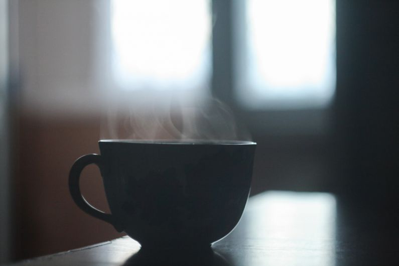 Flavored Tea Meng - black ceramic teacup on table