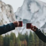 British Afternoon Tea - two person holding red mugs