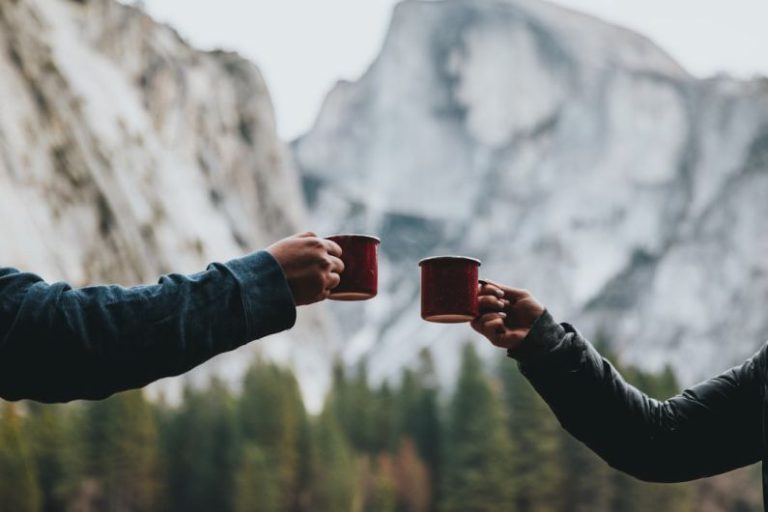 British Afternoon Tea - two person holding red mugs