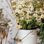 Russia Tea Samovar - Person Holding White and Yellow Flowers in Vase