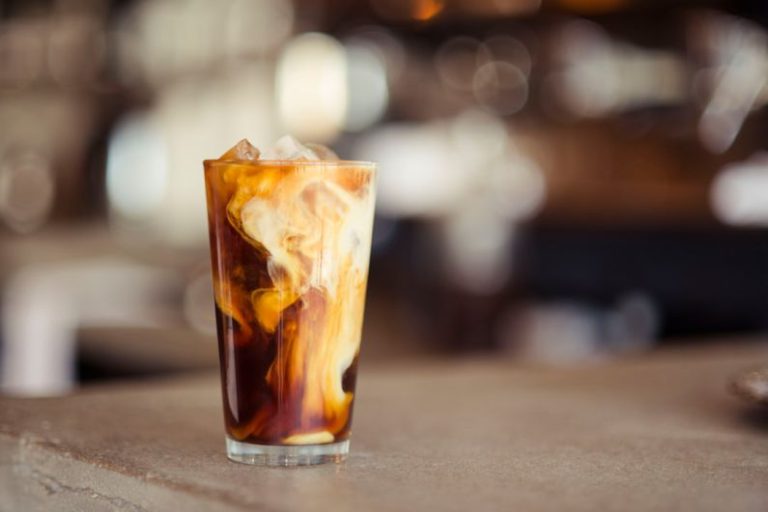 Irish Tea Cup - glass cup filled with ice latte on tabletop